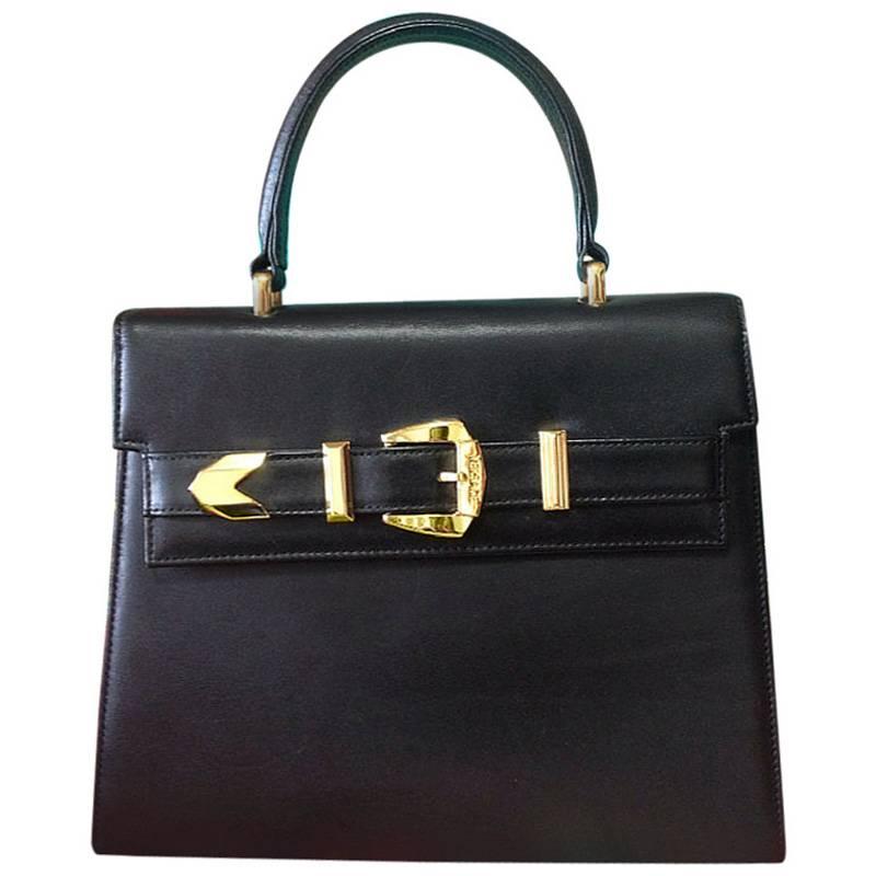 Vintage Gianni Versace black leather Kelly style bag with golden buckle closure  For Sale
