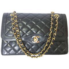 MINT. Vintage Chanel black 2.55 classic double flap purse, gold and silver cc