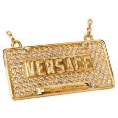new VERSACE gold tone metal crystal embellished ID dog tag Medusa necklace
