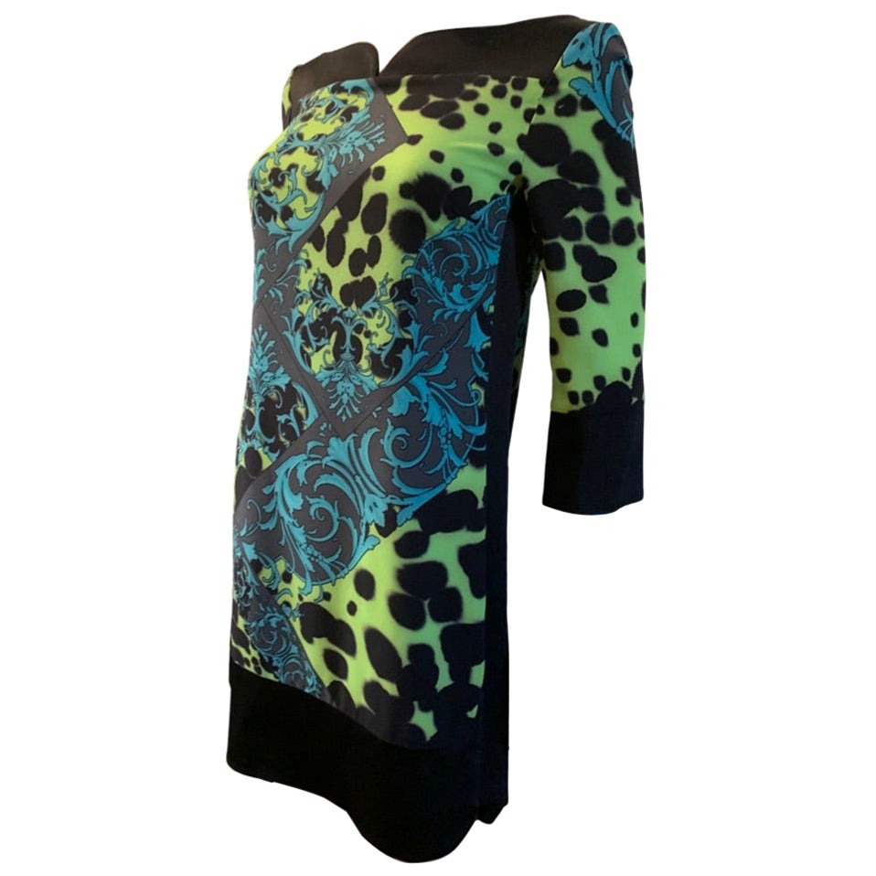 A very chic and easy chemise dress by Versace Collection. The modern print is a mixed of animal and Versace revival in a very fluid  polyester fabric. Sculpted neckline and side hem in solid black acetate sateen fabric. Size 40 Italian. Size 4 US.