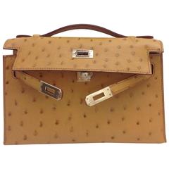 $21000 wire. New Mykonos Ostrich Kelly Pochette Ghw. C stamp full