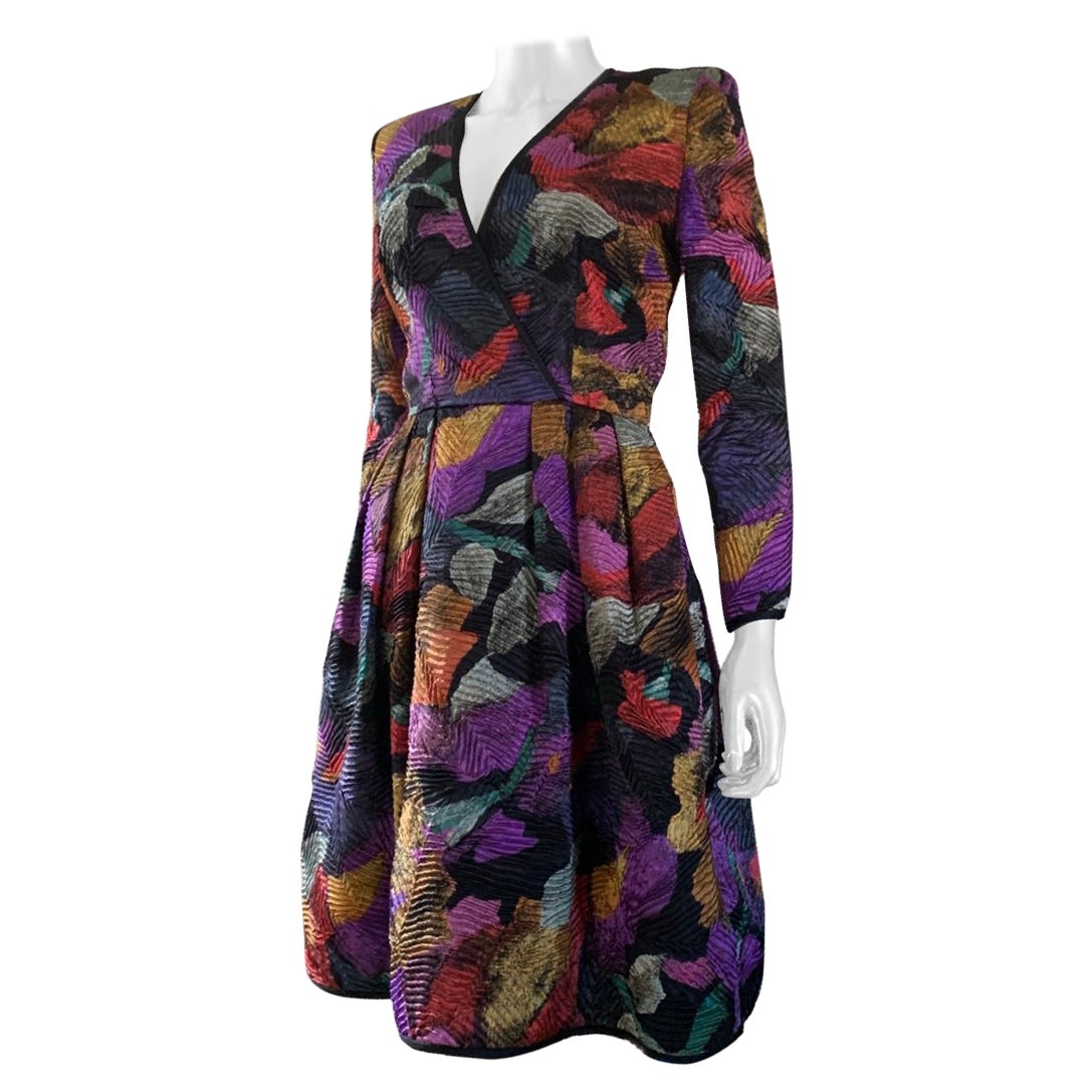 This dress is just a wow show stopper. Design by duo Stanley Platos and Martin Ross, the fabric is done in a hammered pleated satin and an amazing jewel tone modern art abstract. Fabric content tag has been removed but it looks like a fine European