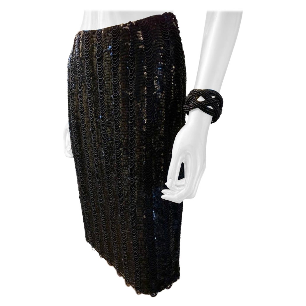 This skirt is a work of art, completely hand beaded with tiniest of beads swagged in between black sequins on the entire skirt! the skirt was custom ordered by a Fashionista in NYC, and made by hand, couture style in USA by Badgely Mischka . 100%