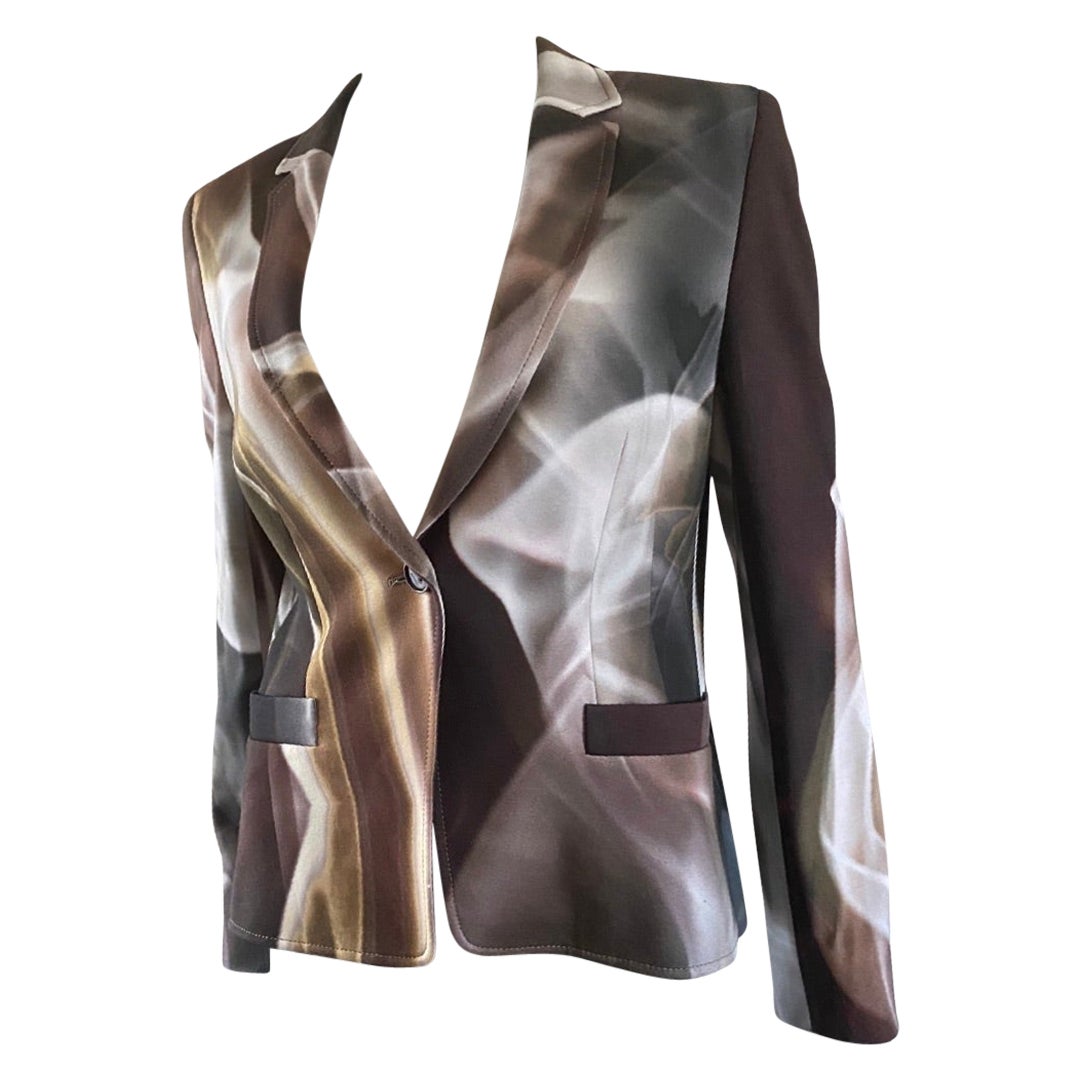 The print on this Escada blazer is so cool and modern. It looks like a colorized version of smoke in the air. Crème, greens and browns go with so many things! Made in Croatia European size: 40. US size: 10 fabric: 93% viscose 7% Elastane.
