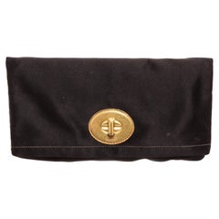 Coach black satin Amanda clutch with gold-tone hardware, logo placard at front
