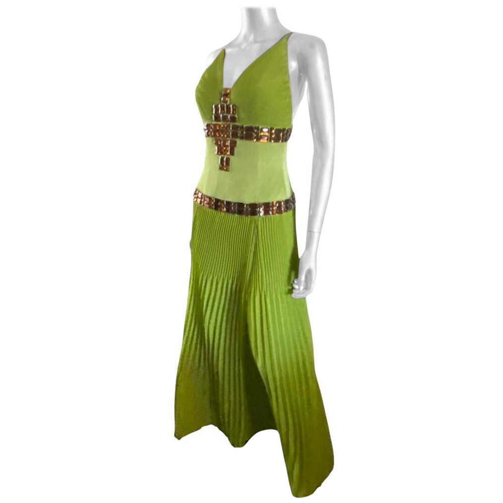 The color! This halter dress is the most beautiful shade if lime and looks amazing with topaz brown stones hand-beaded on the dress.The dress is pleated chiffon on bodice and skirt. Below the bust and beading is made with a charmeuse fabric to