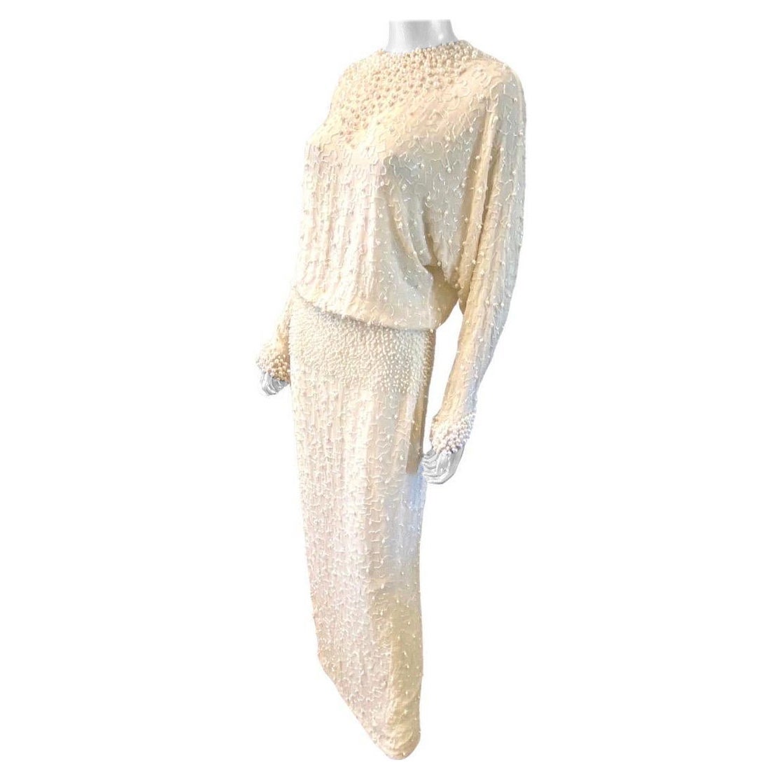 A showstopper. Awards show worthy evening gown dripping with pearls and bugle beads from late 70s by Pavé Beverly Hills. The very high and Collection was available only at Pavé Beverly Hills in New York and some Saks Fifth Avenue stores. The dress