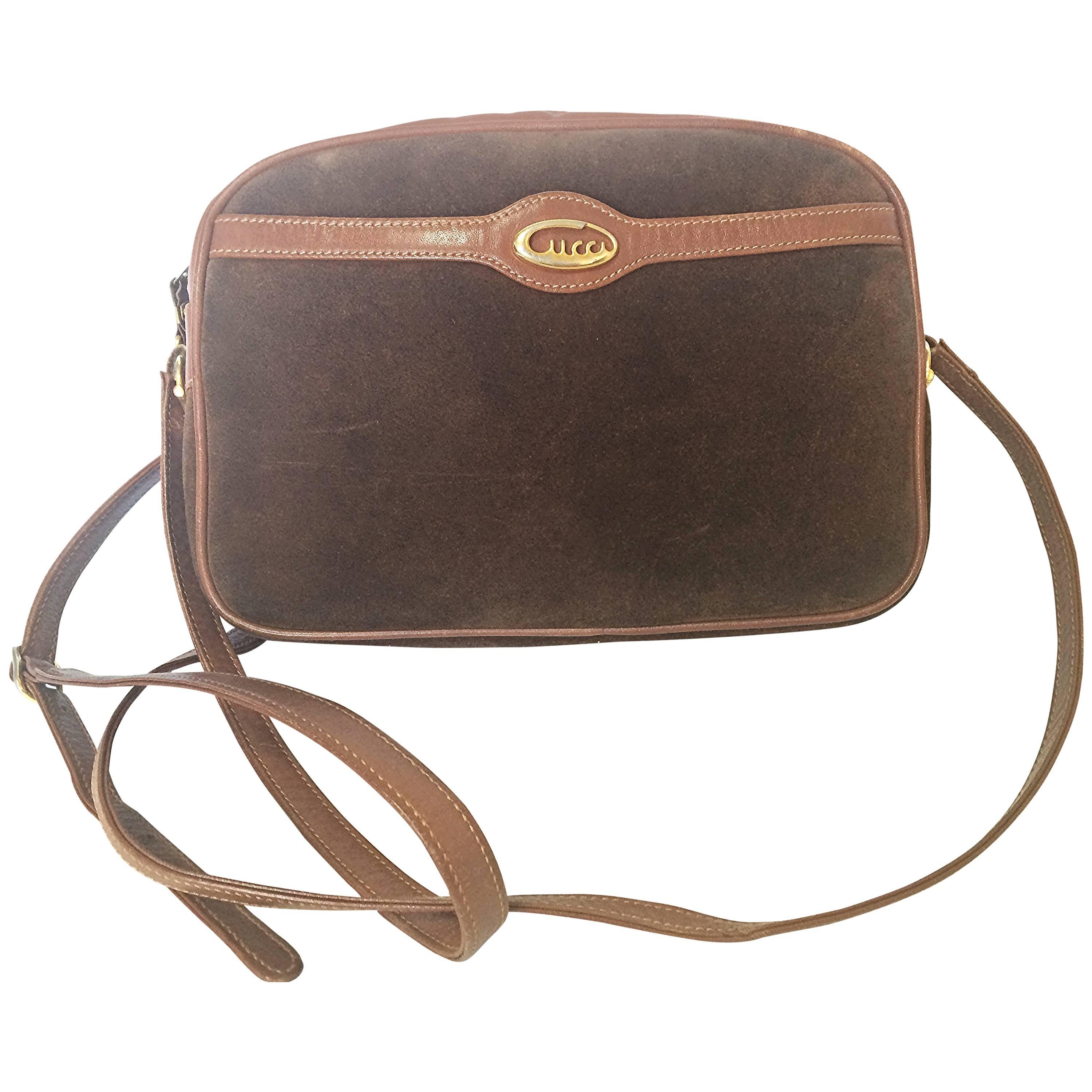 Vintage Gucci brown suede oval shape shoulder purse with riri zippers.
