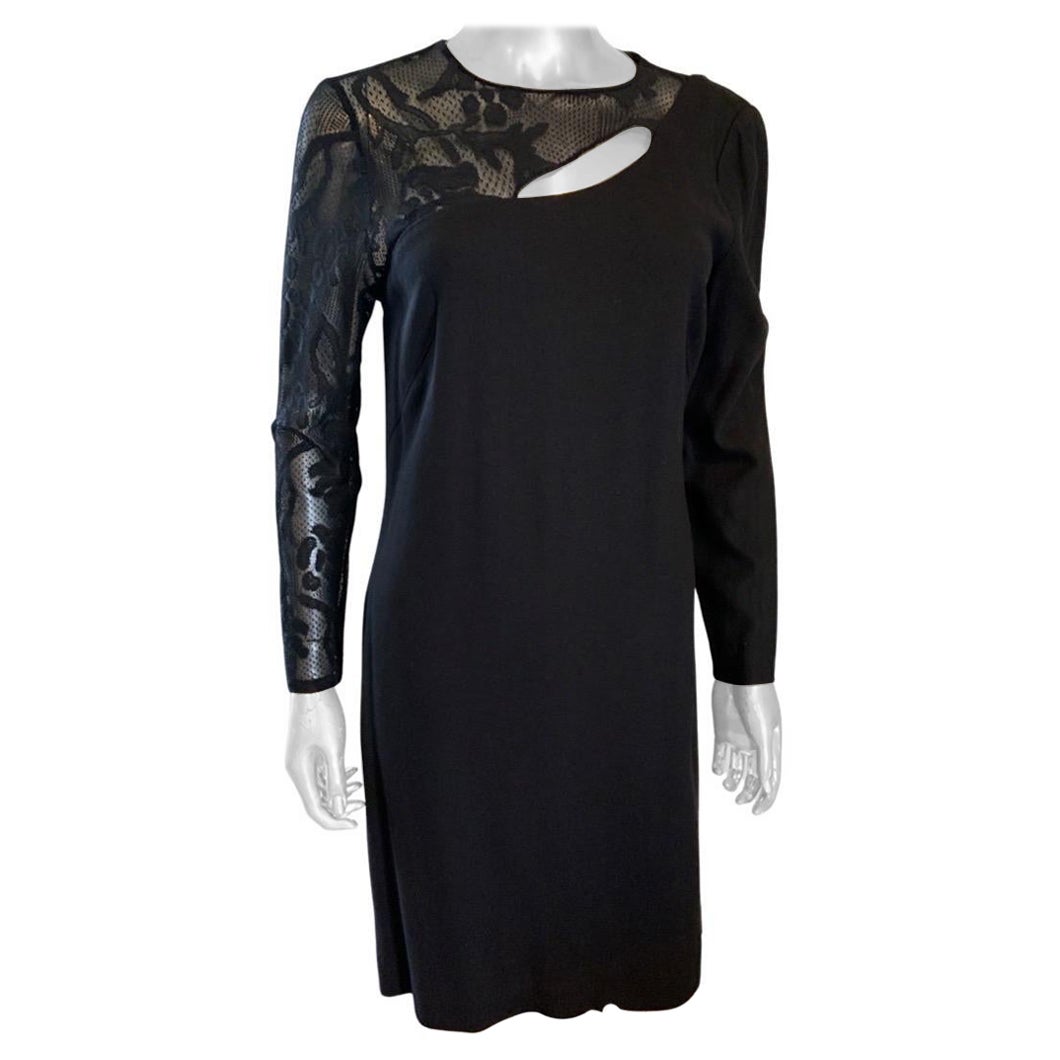 From our “Little Black Dress” collection a Worth New York Chemise that can go from day to evening.. The asymmetrical dress has a lace sleeve and bodice with small peekaboo slit. The other sleeve and body of the dress is in a beautiful fluid rayon