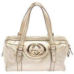 Gucci - Sac Boston Britt en cuir doré métallisé