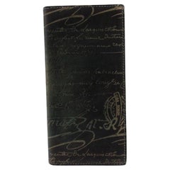 Berluti Calligraphy Bifold long wallet is crafted in black Scritto leather