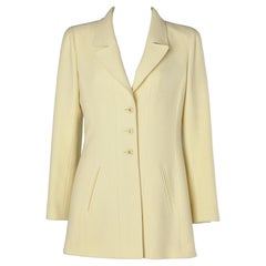 Pale yellow wool single breasted jacket with branded buttons Chanel Boutique 
