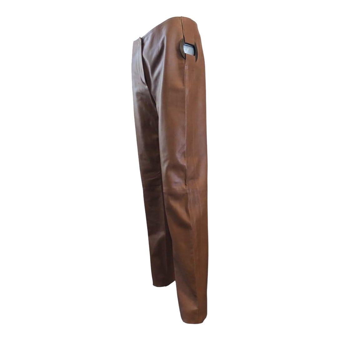 These very high-end Valentino cognac colored leather pants were purchased at the Valentino boutique in New York City. They were worn once to a celebrity event in Beverly Hills. Designed when the original Mr. Valentino Garavani did amazingly chic