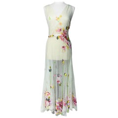 A Romantic Dress in white cotton Net applied with printed Chiffon Circa 1938