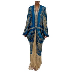 Morphew A., bozzolo in seta lamé metallizzata blu oceano con frange e vint blu.