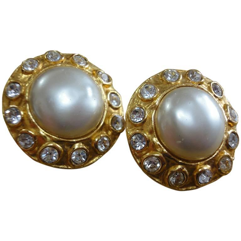 Vintage CHANEL gold tone earrings with faux pearl and rhinestone crystals.  For Sale