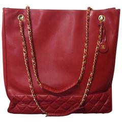 Vintage CHANEL lipstick red leather large tote bag with golden chains and cc.