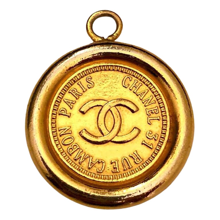Vintage CHANEL Gold Toned Cambon Coin Pendant Charm For Sale