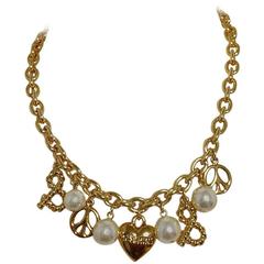 MINT. Retro Moschino statement necklace with heart, peace mark, faux pearls. 