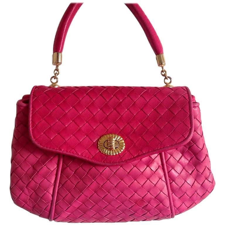 Vintage Bottega Veneta classic intrecciato woven leather handbag in hot pink. For Sale