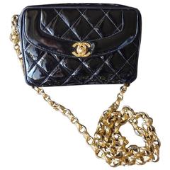 Vintage CHANEL quilted patent enamel leather black camera bag, golden chains