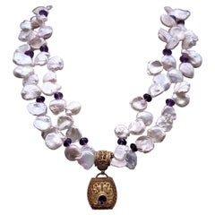 A.Jeschel Double strand Keshi Pearl with an Amethyst vermeil pendant.