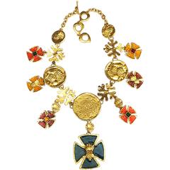 MINT. Vintage Yves Saint Laurent statement necklace with enamel cross charms.