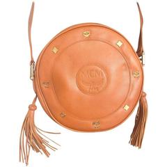 Vintage MCM brown leather round shoulder bag, fringe. Designed by Michael Cromer