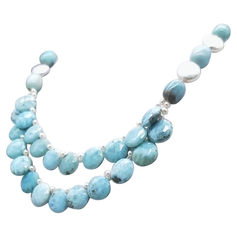 One-of-a-Kind
Make a statement with this uniquely sea-colored Larimar and pearl necklace. Mined exclusively from the Dominican Republic's underwater mines, Larimar is a rare and precious gemstone that is sure to turn heads.
This necklace features a