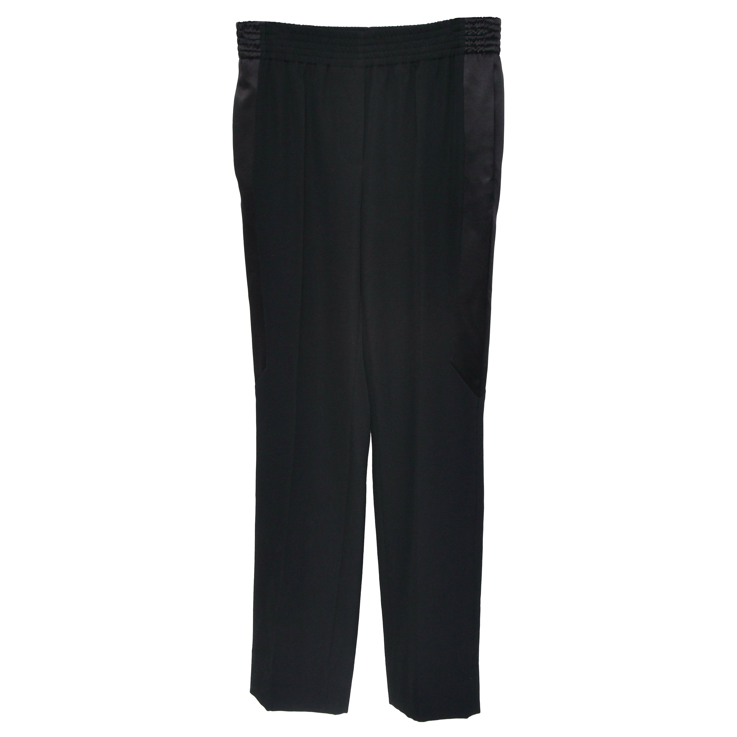 GUARANTEED AUTHENTIC GIVENCHY BLACK WOOL PANTS WITH SIDE PANELS

Retails excluding tax, $1,430
Details:
• Elasticized waist.
• Front side slip pockets.
• Rear slip pockets.
• Faux fly front.
• Center crease down leg.
• Side Viscose Silk blend