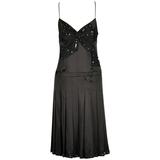 The little black dress by Chanel black and white silk Sculpted figure ...