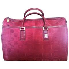 Vintage Givenchy travel duffle bag in logo jacquard wine color fabric. Unisex