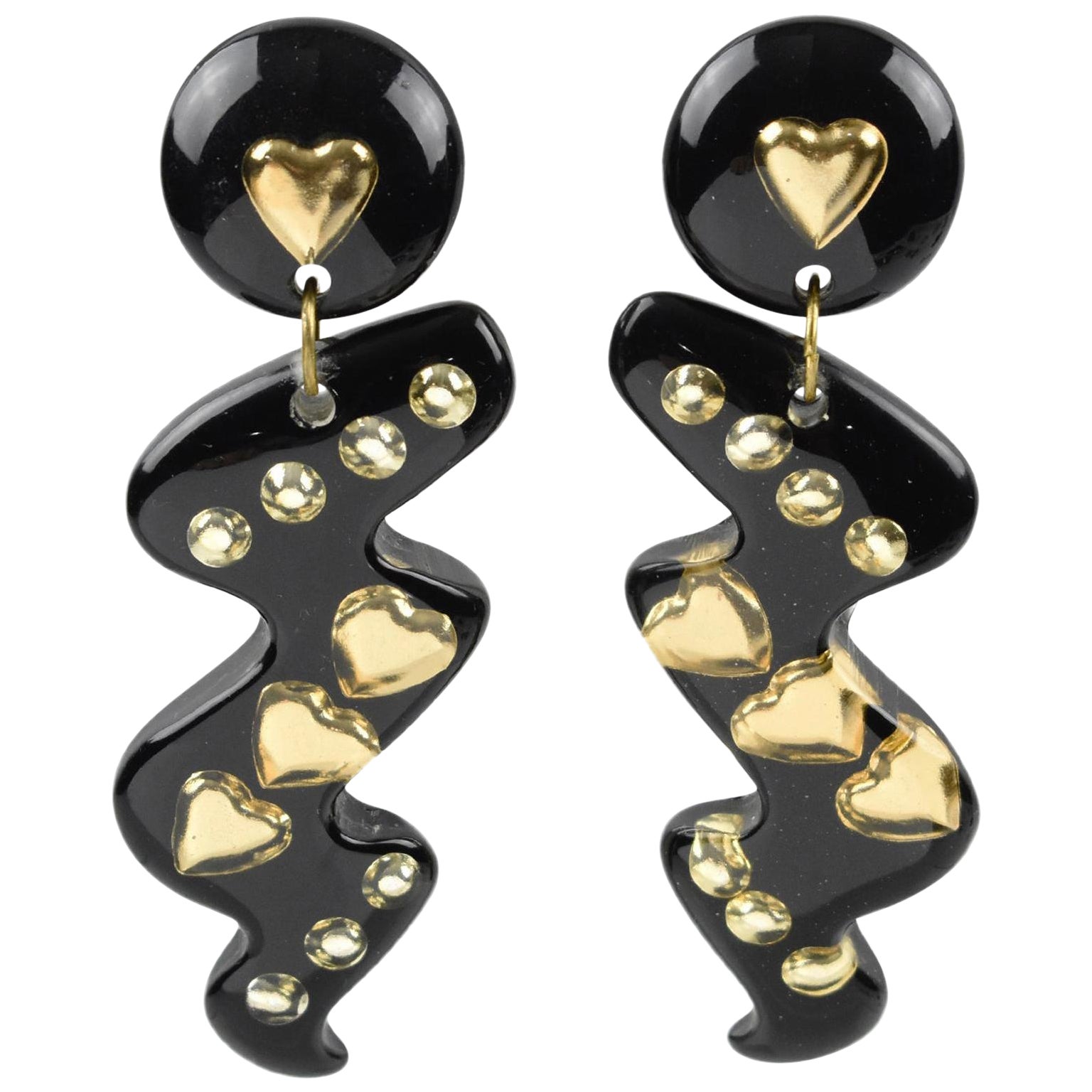 Oversized Dangle Black Lucite Clip Earrings with Gilded Heart Inclusions For Sale