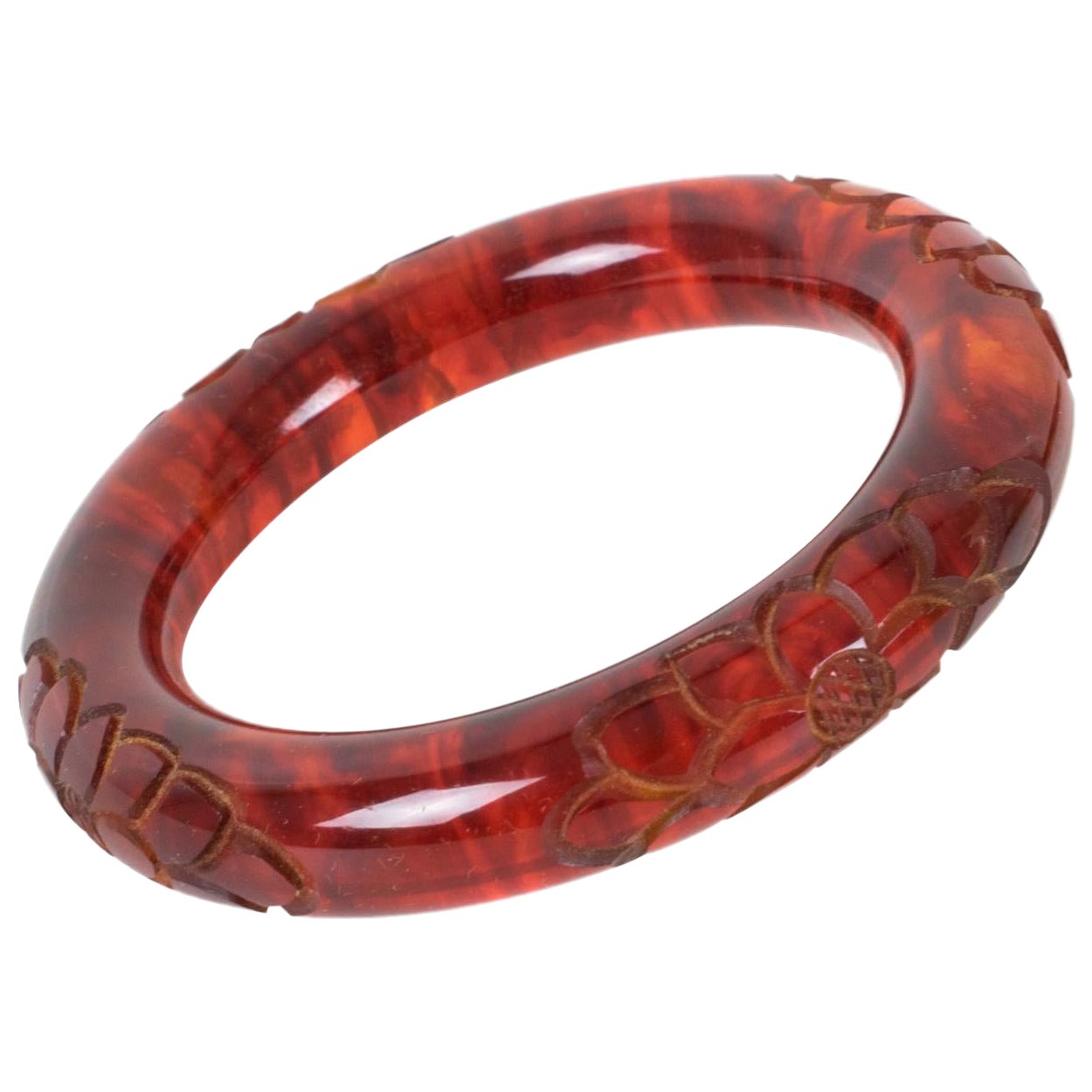 Bakelite Carved Bracelet Bangle in Cloudy Red Tea Amber Color For Sale