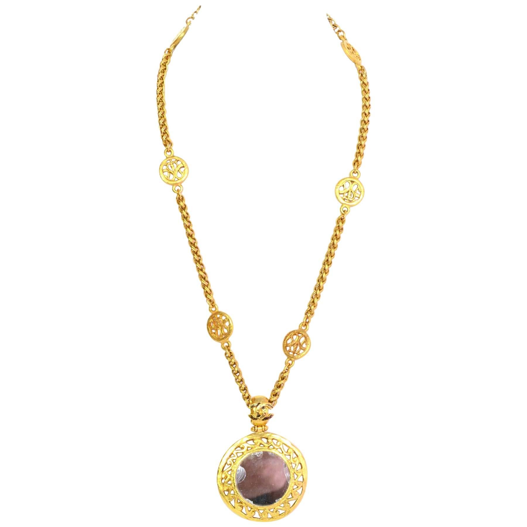 Chanel Gold-tone Mirror Necklace

Features circle mirrior pendant

Made In: France
Year of Production: Autumn 1995
Color: Goldtone
Materials: Metal
Closure: Hook and eye closure
Stamp: Chanel 95 CC A made in France
Overall Condition: Excellent