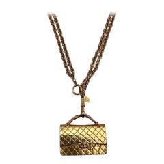 Pendentif de sac vintage Chanel en or 24 carats, années 1994