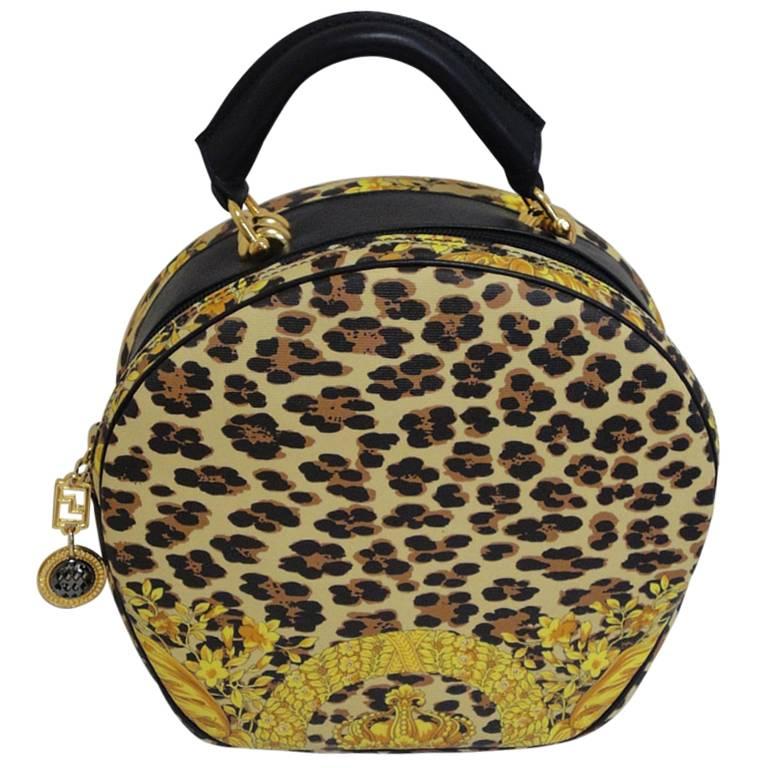  MINT. Vintage Gianni Versace leopard and gorgeous print round bag with strap.