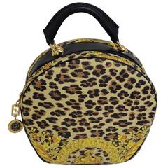 MINT. Vintage Gianni Versace leopard and gorgeous print round bag with strap.