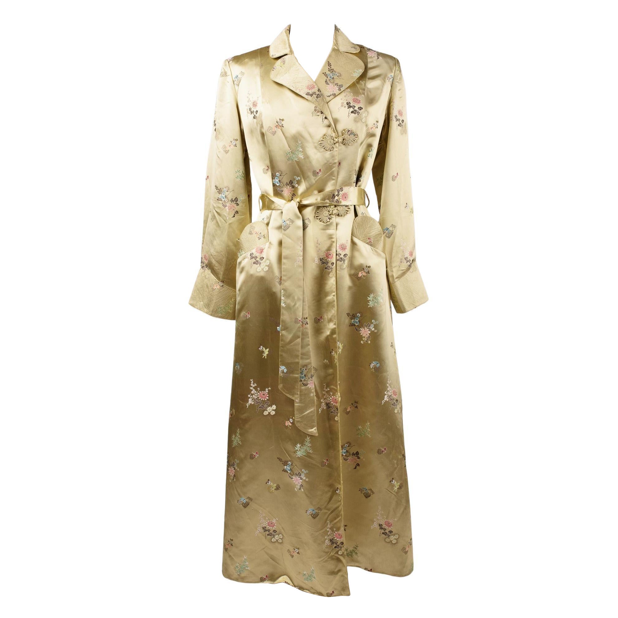 A Pale yellow brocaded satin Interior dressing gown Circa 1940-1950