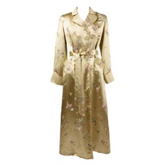 A Pale yellow brocaded satin Interior dressing gown Circa 1940-1950