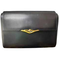 Retro Cartier black navy  leather classic shape clutch bag with blue stone.