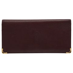 Cartier Burgunderfarbene lange Brieftasche aus Leder Must De Cartier