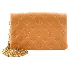 Louis Vuitton Gold Monogram Coussin Pochette Silvery Golden Leather Metal  ref.488949 - Joli Closet