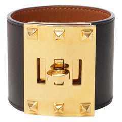 HERMES Kelly Dog Extreme 18k yellow gold plated brass turnlock stud black cuff