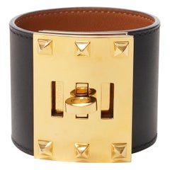 Hermès Kelly Extreme 18k Gelbgold vergoldete schwarze Armbanduhr mit drehbarem Ohrstecker