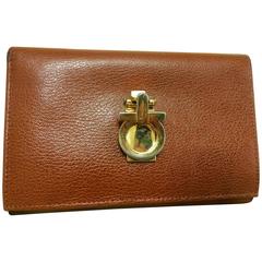 Vintage Salvatore Ferragamo brown leather long wallet with gold tone gancini
