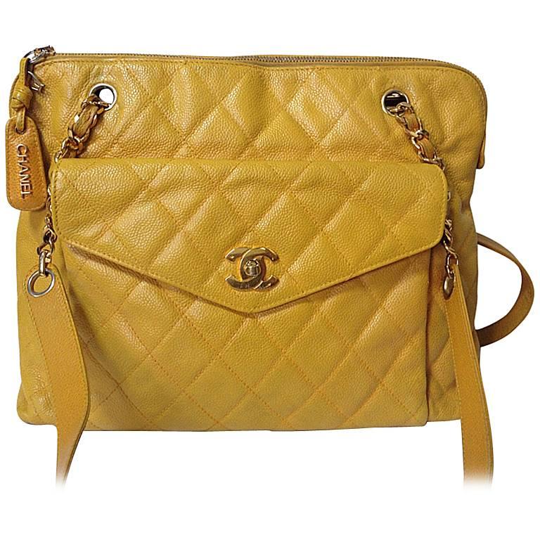 Vintage Chanel yellow caviar leather chain shoulder tote bag with golden CC. For Sale