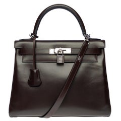 Prächtige Hermès Kelly 28 retourne Handtasche aus braunem Kalbsleder, SHW