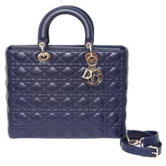 CHRISTIAN DIOR Grande bandoulière cannage bleu marine Lady Dior avec poignées supérieures dorées