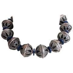 Masha Archer White Metal Blue Wreath Necklace